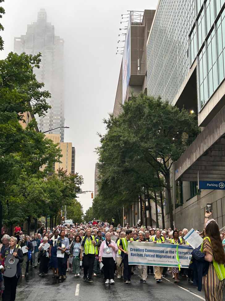 A group of people marches in the streets of downtown Atlanta