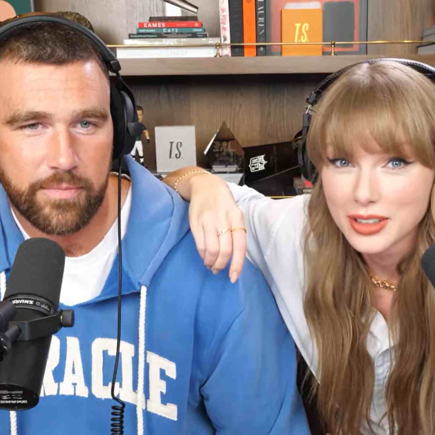 Travis Kelce and Taylor Swift pose for a camera in a screenshot from their Youtube Video: Taylor Swift on Reclaiming Her Masters, Wrapping The Eras Tour, and The Life of a Showgirl | NHTV