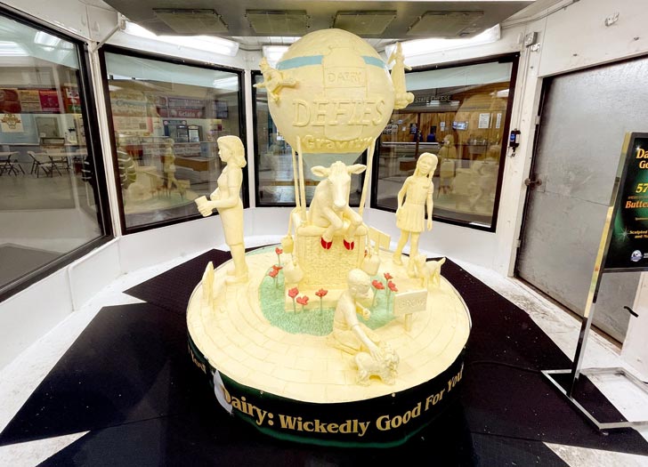 A butter sculpture depicting cows and children at the New York State Fair