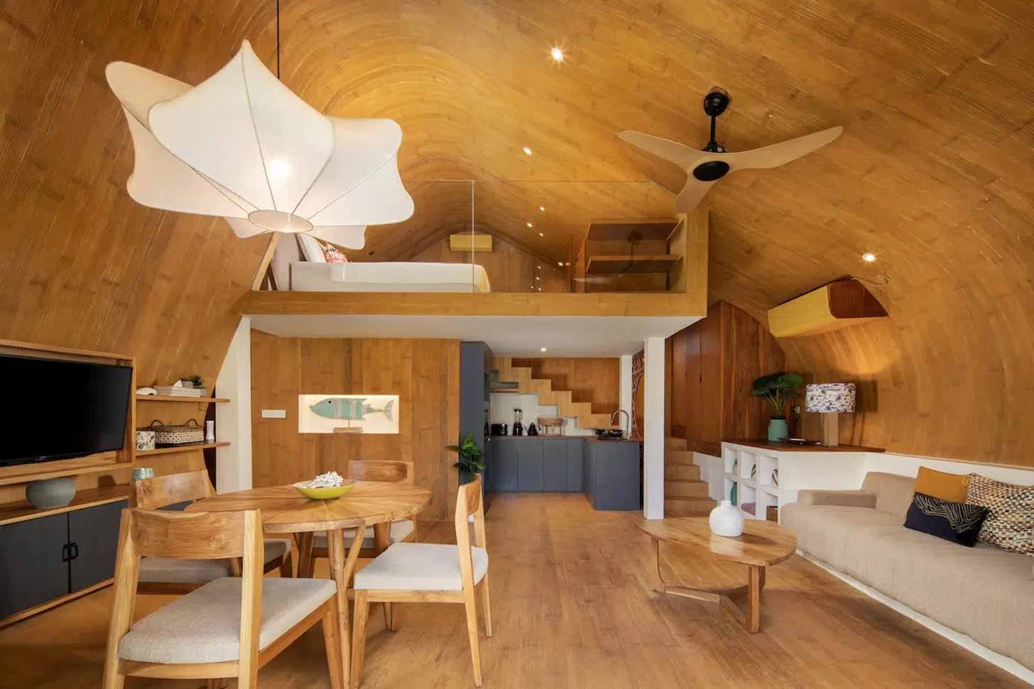 A wooden and modern pod-like tiny home