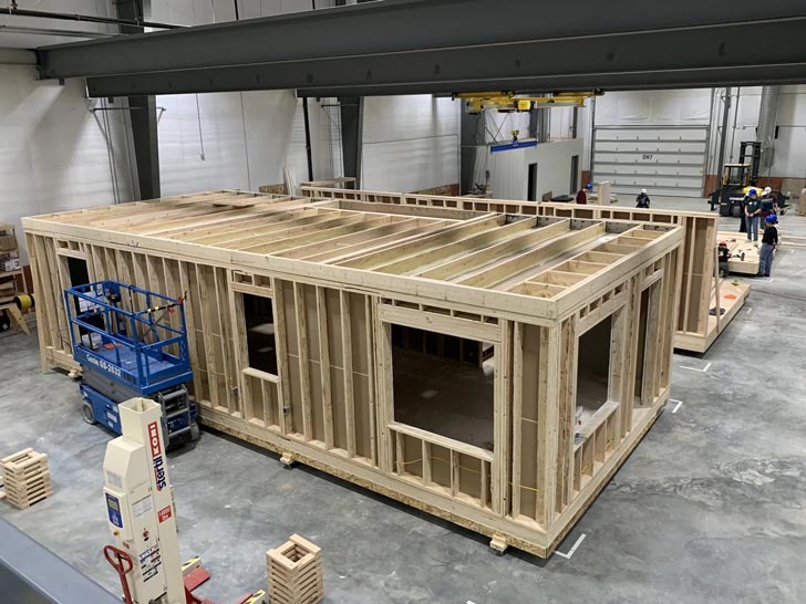 The skeleton of a prefab home inside a factory