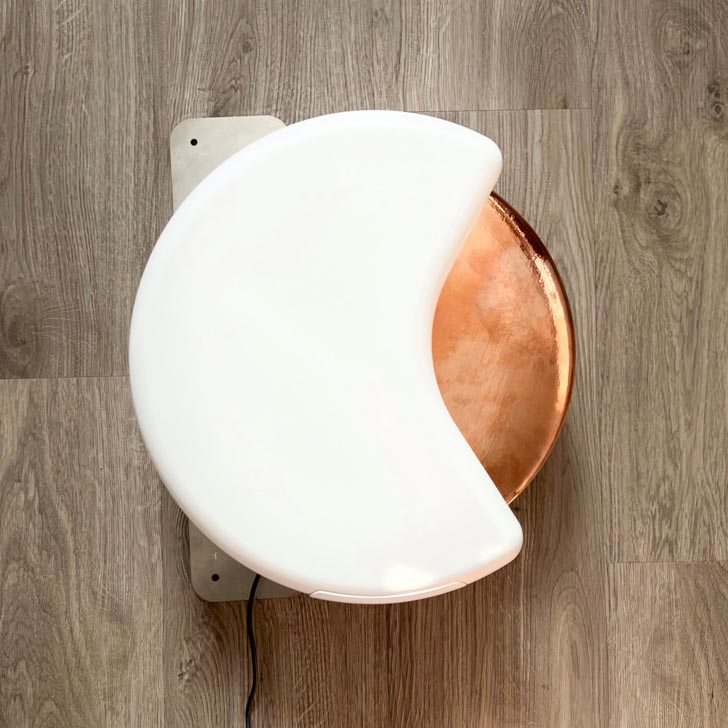 A white semicircle encloses a bronze doorknob
