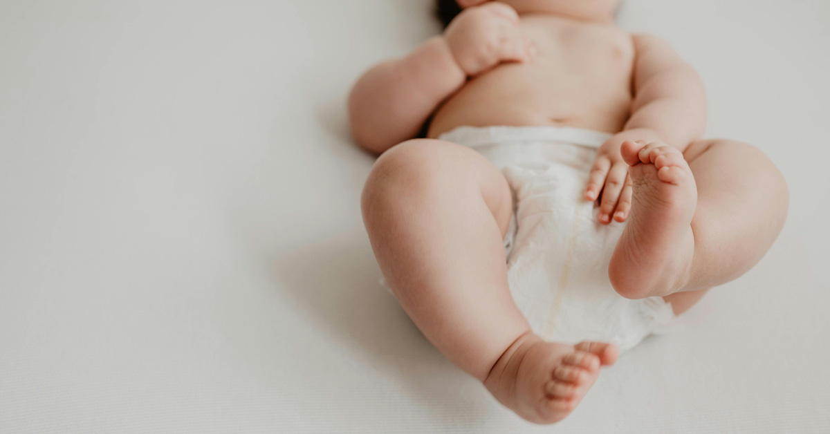 A close-up of a baby's botton in a diaper