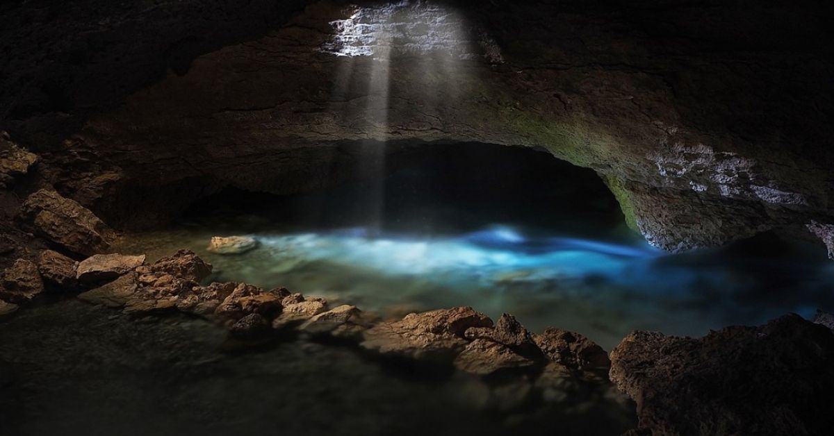 An underground water outlet in a dark cave