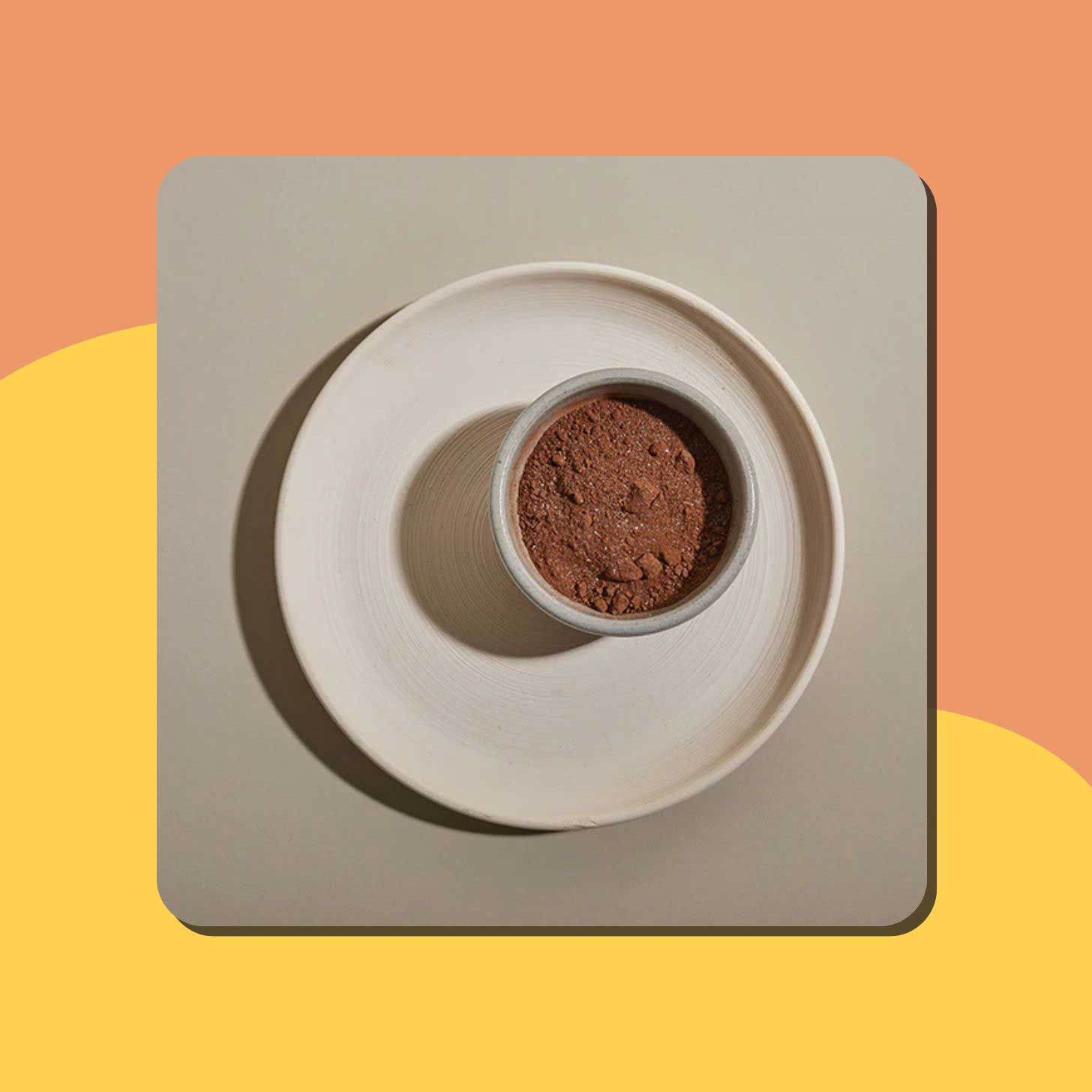 A container of hot cocoa powder on a plate
