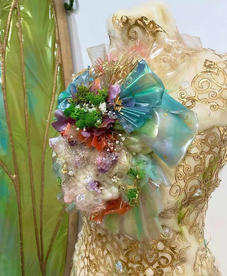 Bright and colorful accessories made out of a seaweed polymer material adorn a manequin