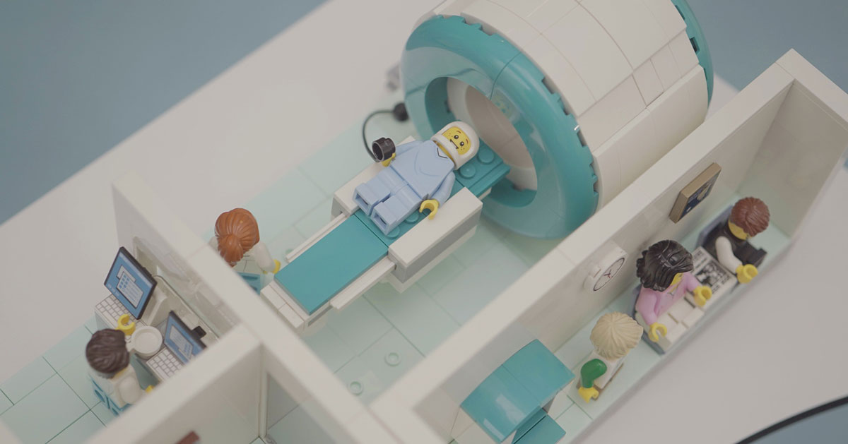 An MRI scene built entirely of LEGO bricks shows minifigures in action 