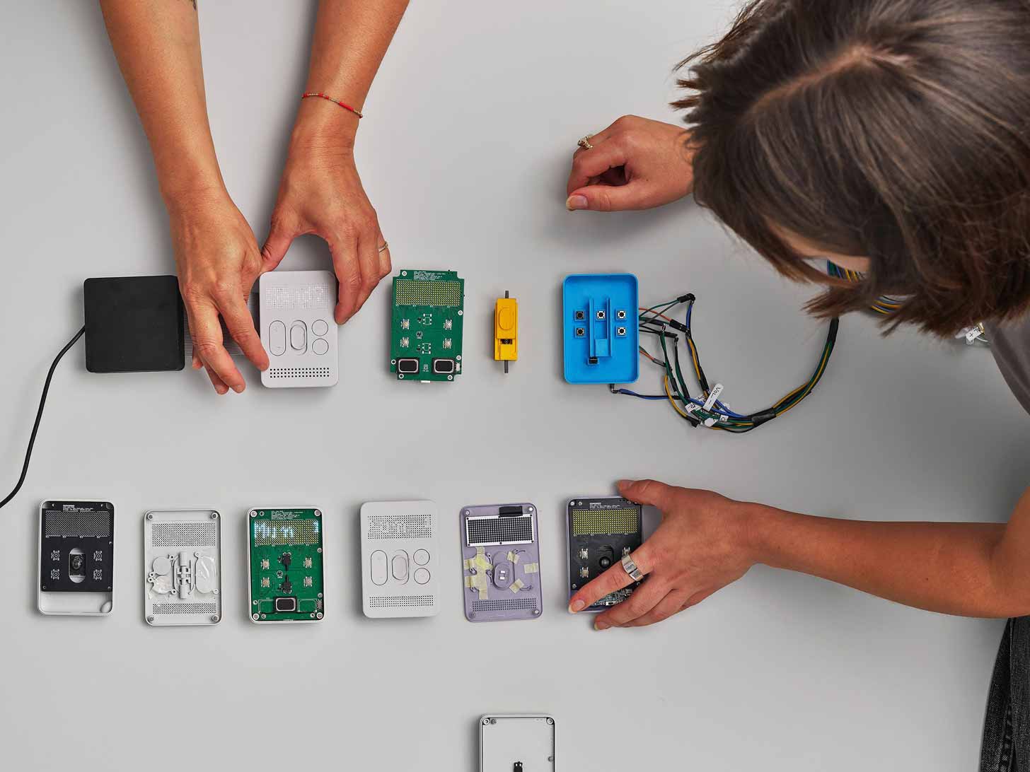 A behind-the-scenes photo of a handful of devices being opened up with a motherboard revealed underneath