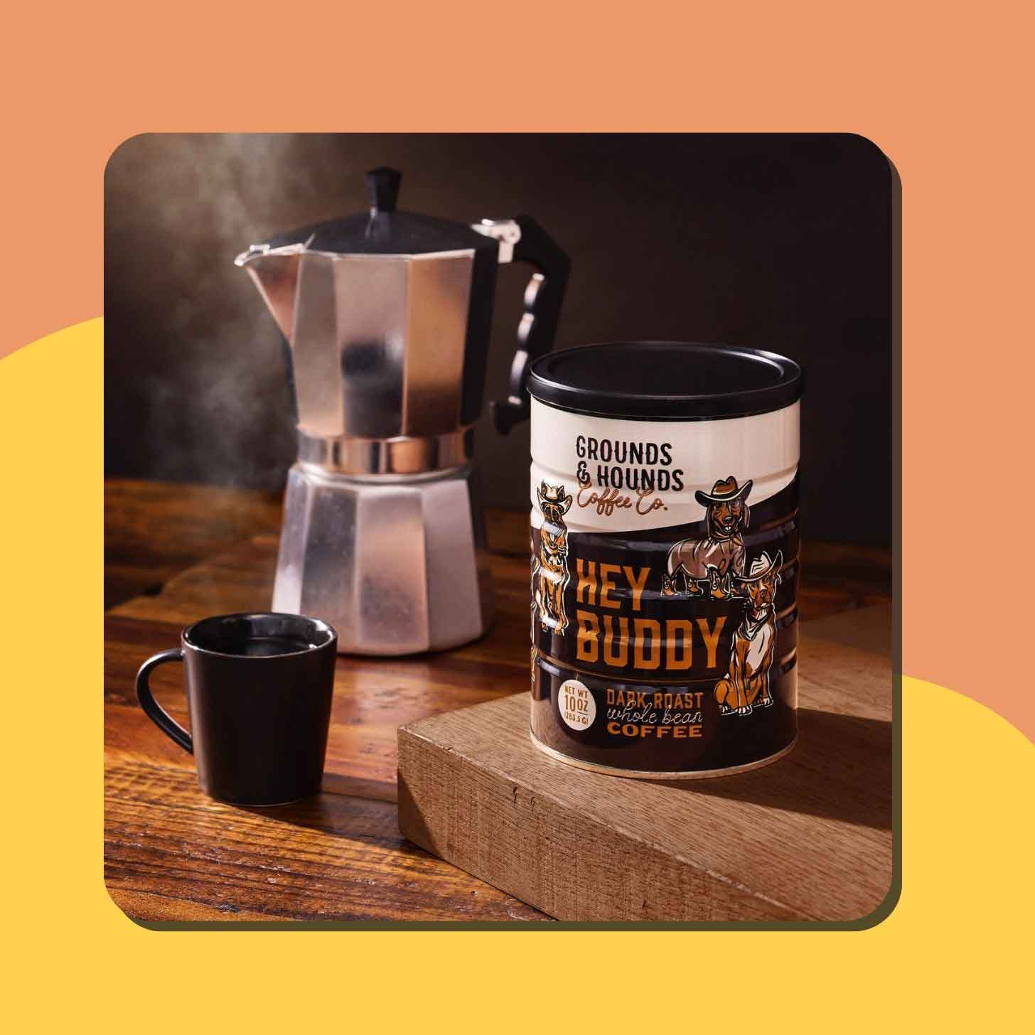 Grounds & Hounds Coffee sits next to a mug and moka pot