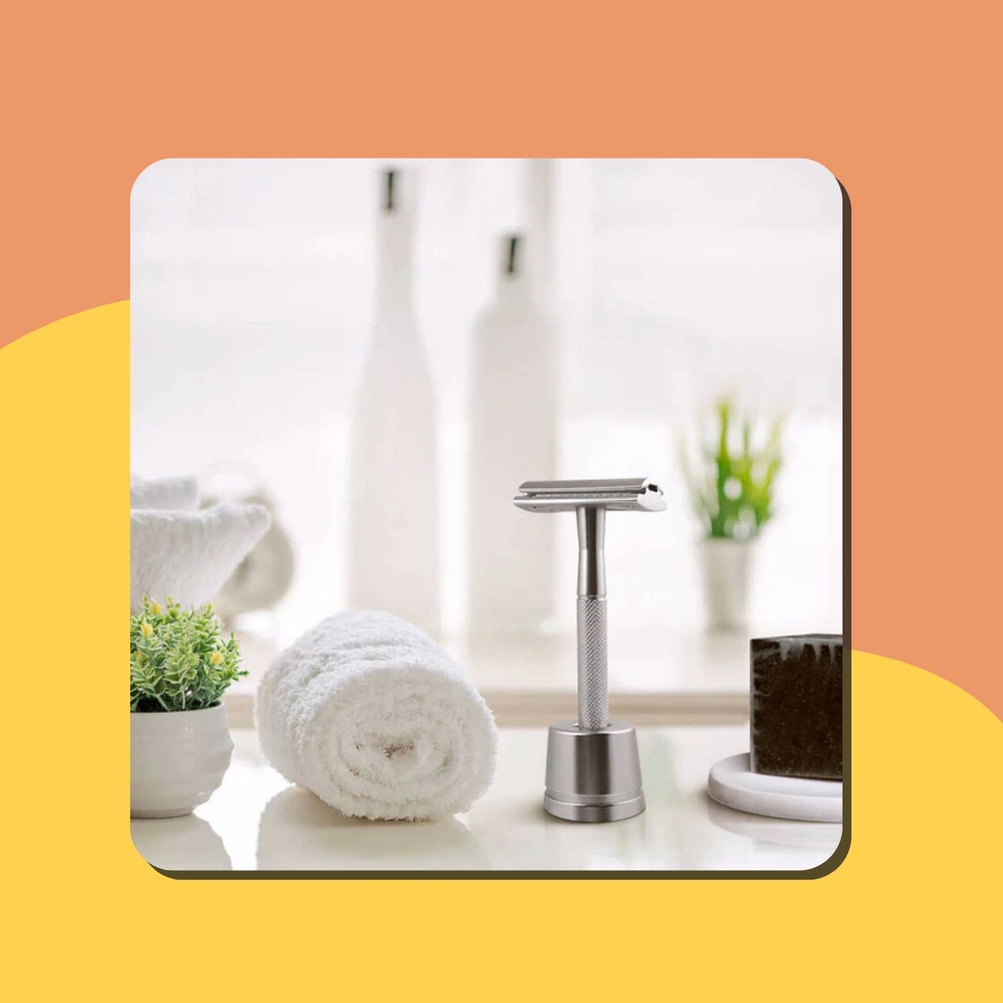 A stainless steel BamBaw Razor sits on a sink
