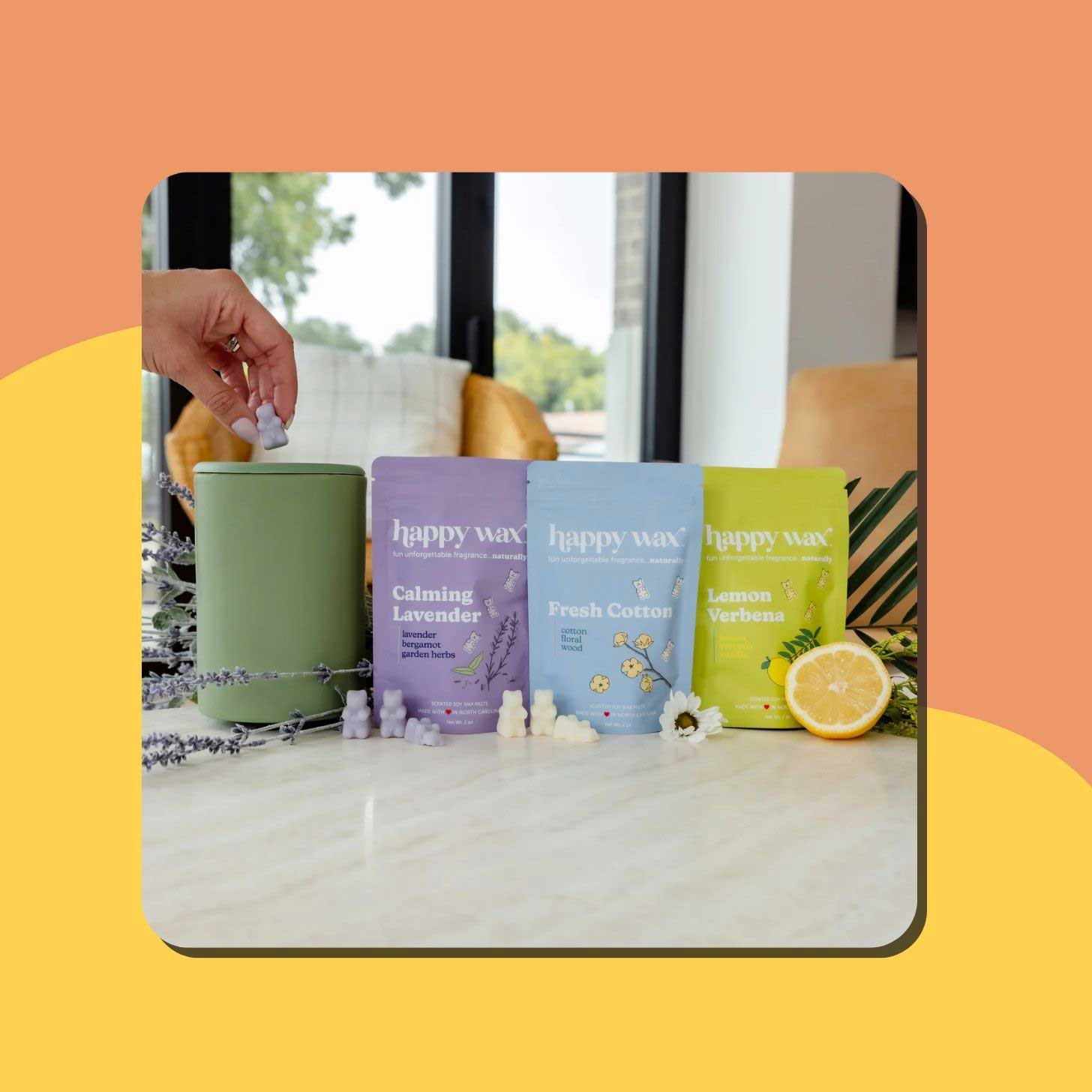 Four bags of Happy Wax wax melts sit on a counter