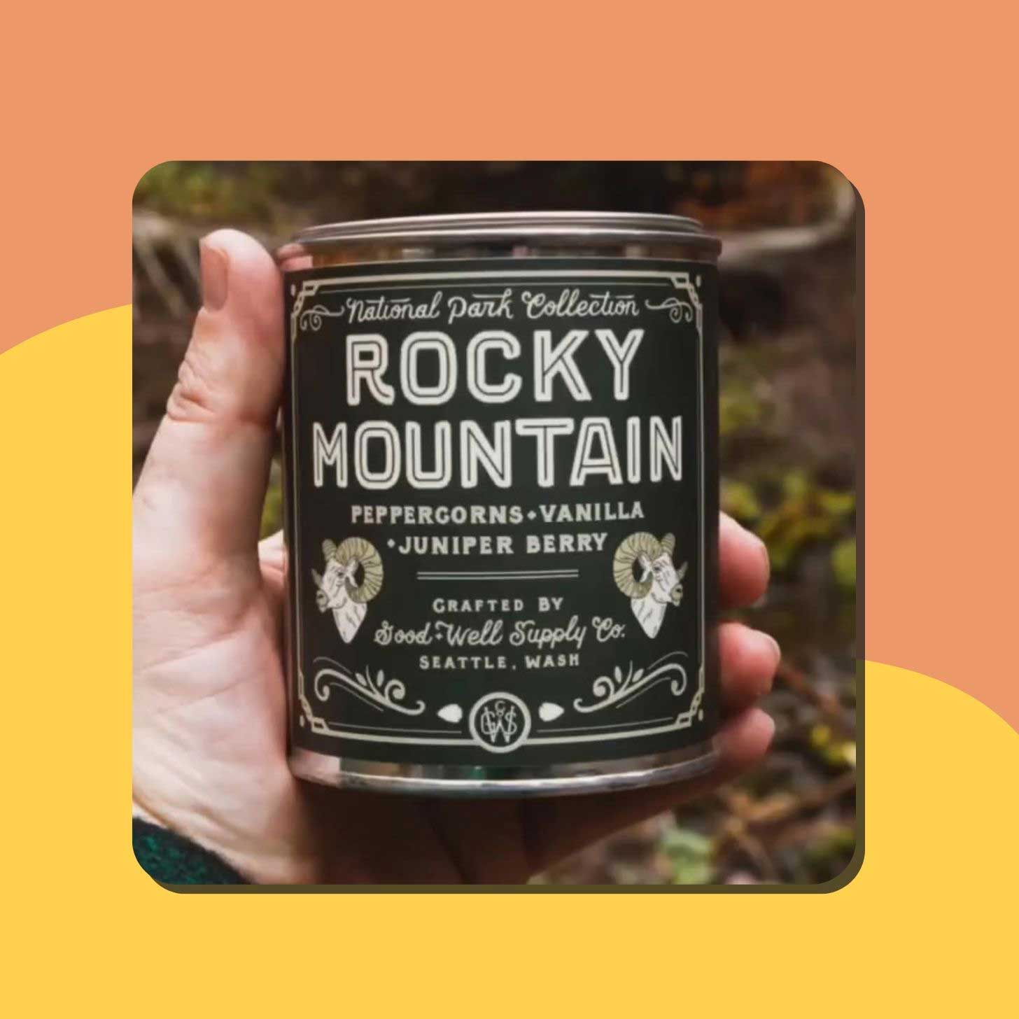 A person holding a candle in an aluminum container