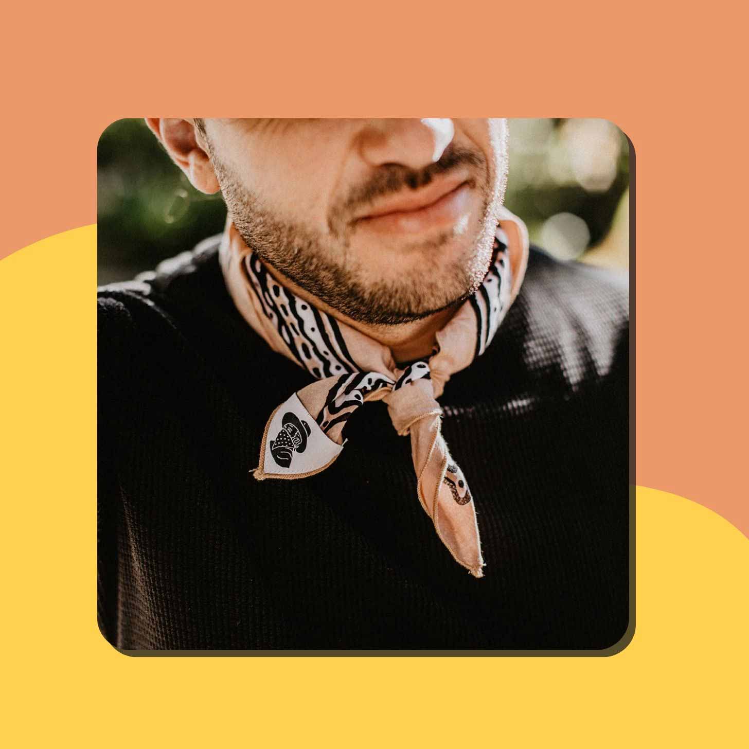 A close-up of a bandana tied around a man's neck