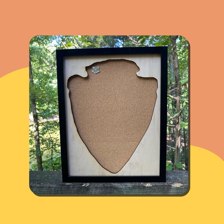 A cork frame in the shape of a national park ranger badge