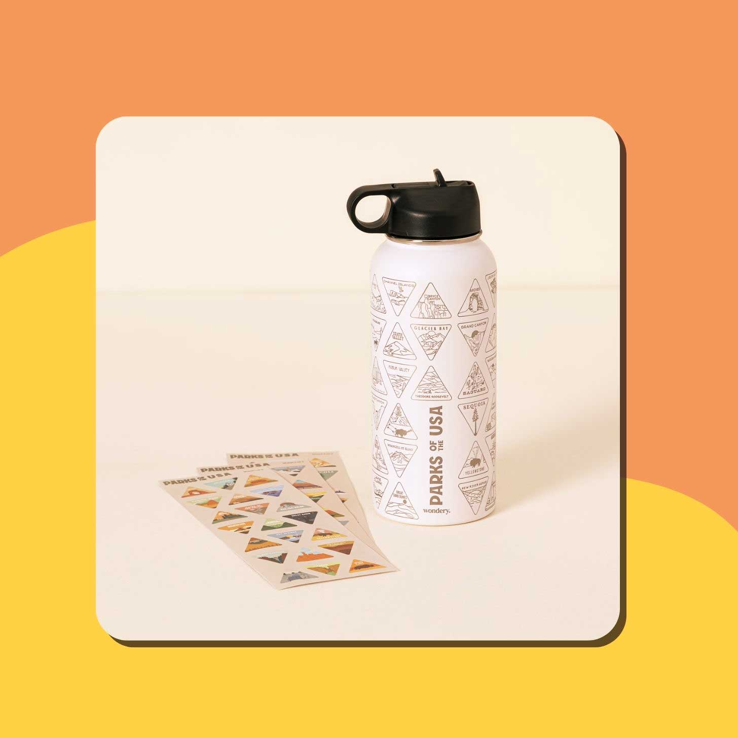 A white water bottle adorned with triangular national park stickers