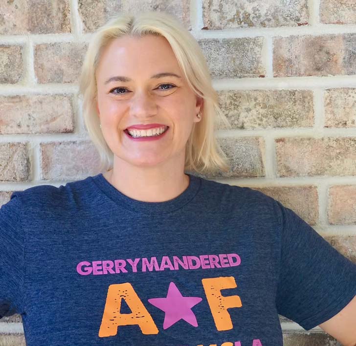 Kate Barr wears a t-shirt that reads 'Gerrymandered AF"