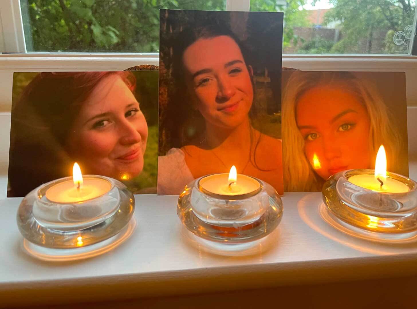 pictures of three young teen women on a mantlepiece with candles lit beneath them