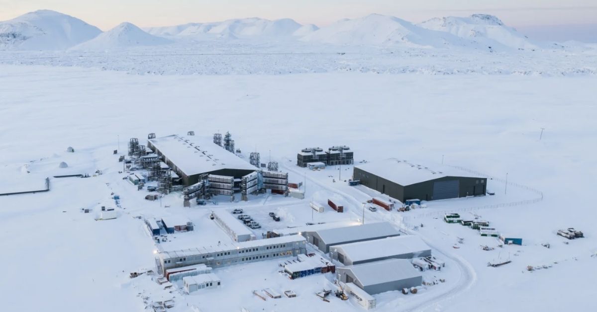a snow-covered facility sits atop a dormant volcano in a bird's eye view