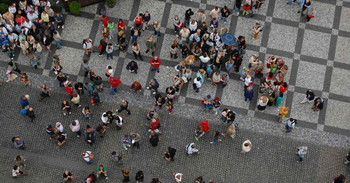 An aerial view of a crowd of people in a city plaza