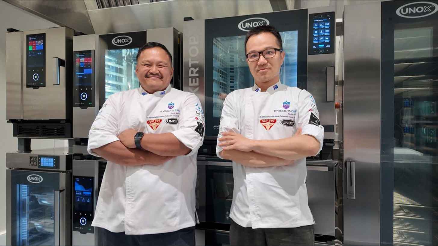 David Martin and Harry Shen in a commercial kitchen