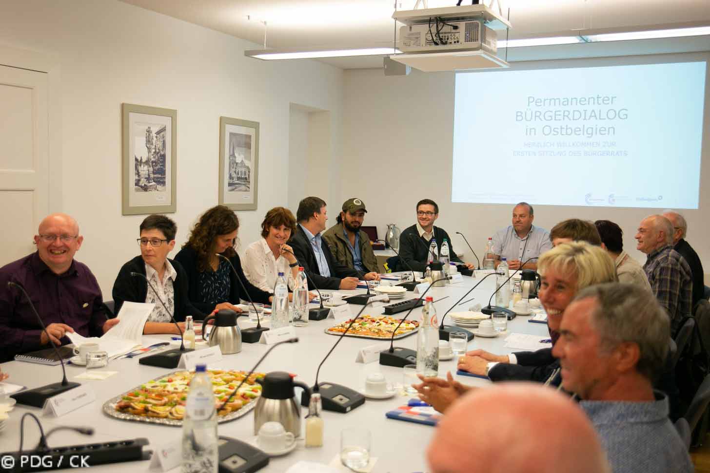 A group of people gathers at an Ostbelgien Citizens Assembly meeting