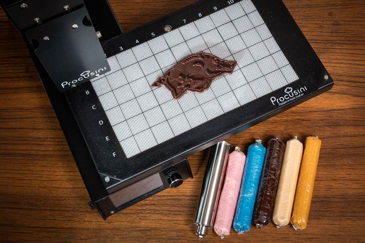 Chocolate is 3D printed into the shape of a Razorback mascot at the University of Arkansas