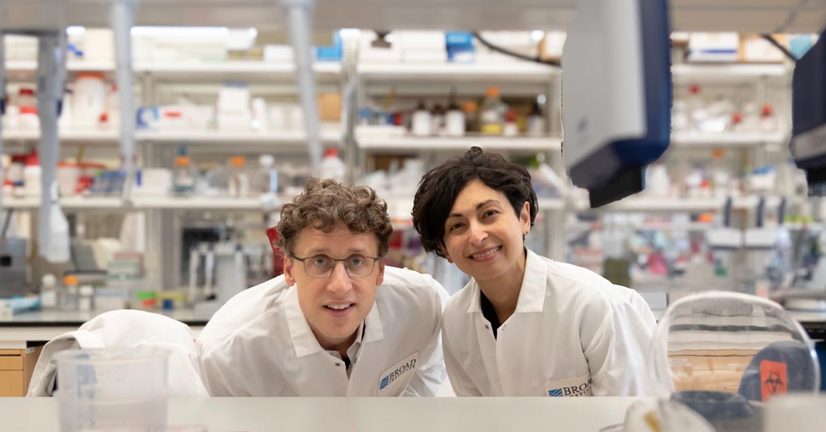 Eric Minikel and Sonia Vallabh smile together in a science lab