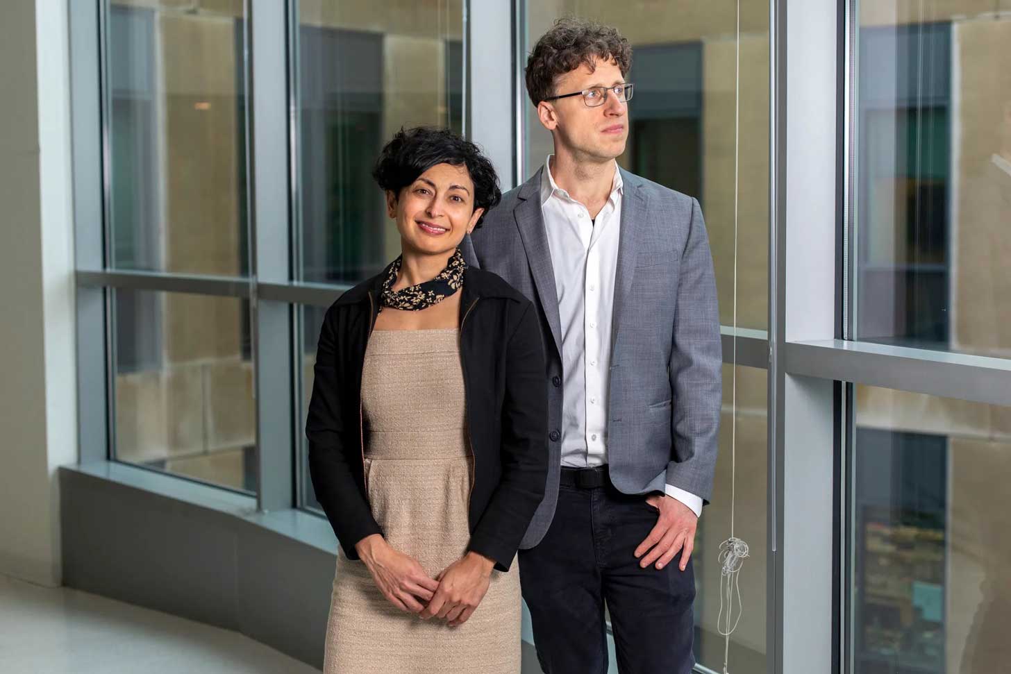 Sonia Vallabh and Eric Minikel stand together at Harvard