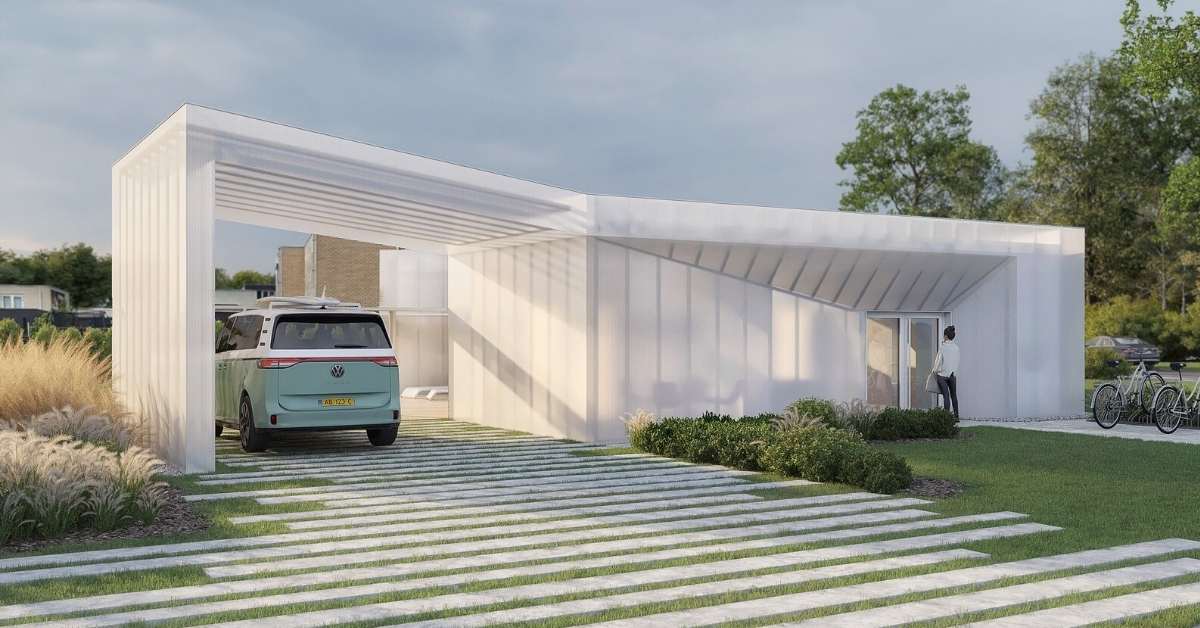 A shiny new white modular house with clear panels. A blue car is parked under a wing of the house. 