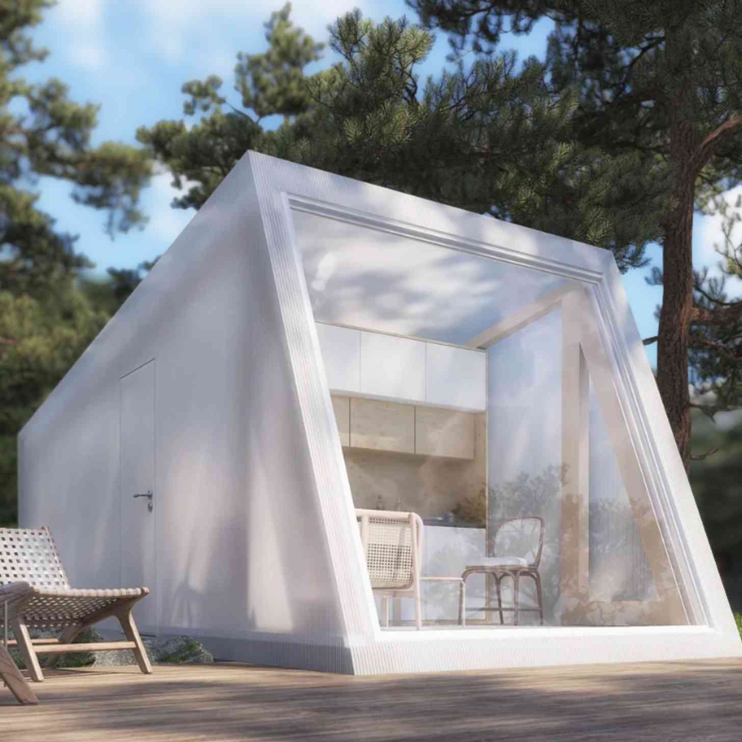 A sleek white house design that is boxy in style with clear panels, framed by forests