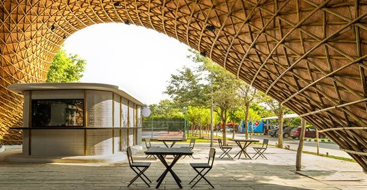The Hungry Caterpillar -- a bamboo structure winding around kitchen stalls printed from concrete.  This is a shot taken from under the shade of the canopy of one of the structures