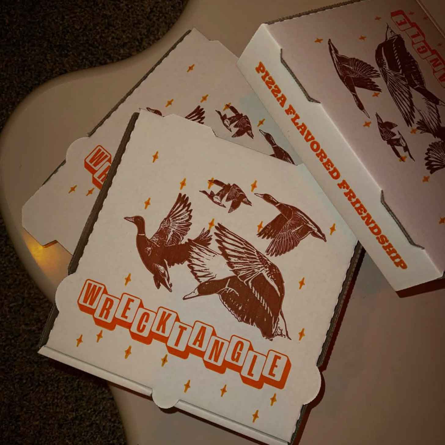 A stack of takeout pizza boxes from Minnesota restaurant Wrecktangle