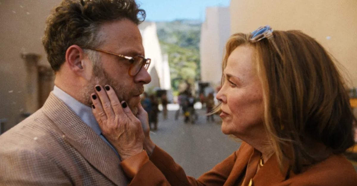 In a still from The Studio, Catherine O'Hara holds the sides of Seth Rogen's face as she tells him off.