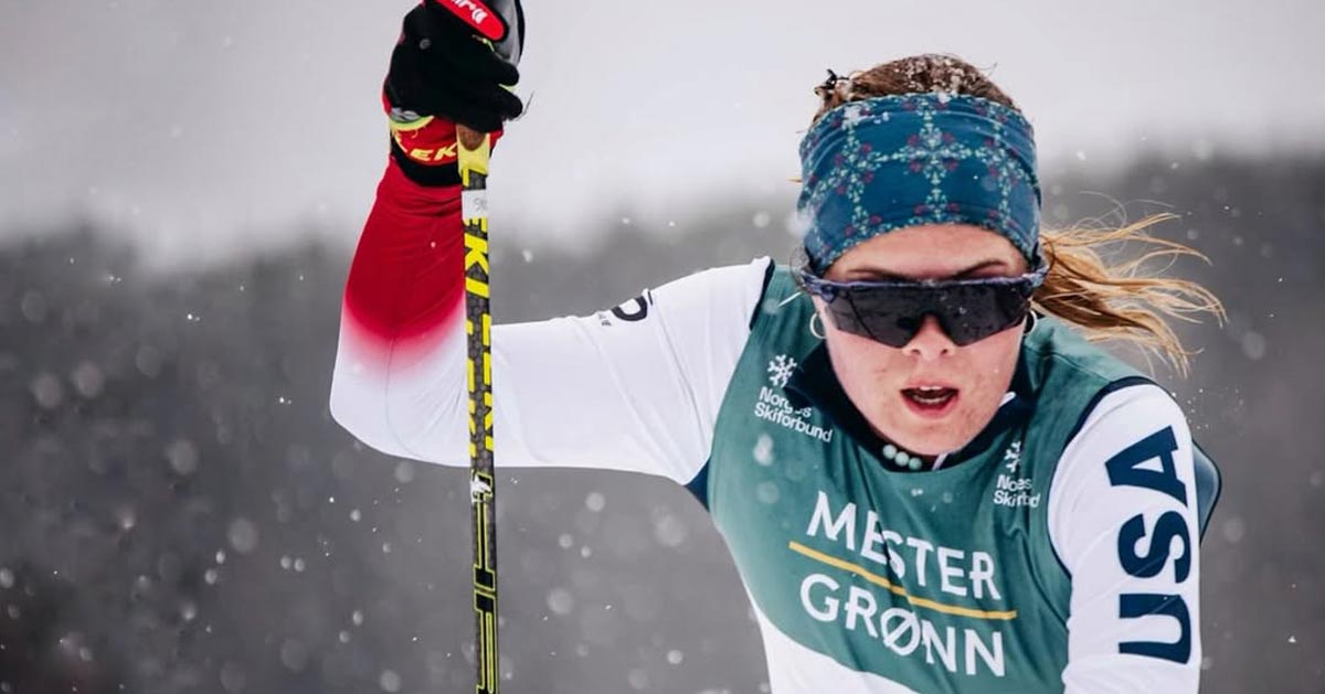 US Paralympic Nordic skier Sydney Peterson holds one ski pole in competition
