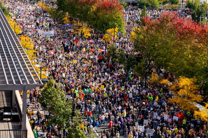 An aerial view of thousands of people in Minneapolis protesting in the "No Kings" march on October 18, 2025