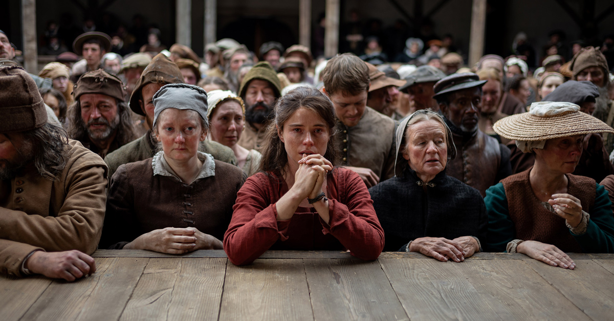 Jessie Buckley holds her hands in prayer in "Hamnet"