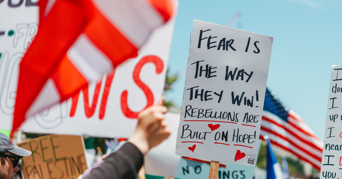 A No Kings protest sign reads: "Fear is the way they win! Rebellions are built on hope"