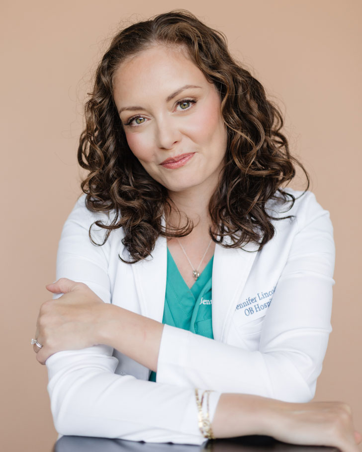Dr. Jennifer Lincoln, an OB-GYN in a white doctor's coat