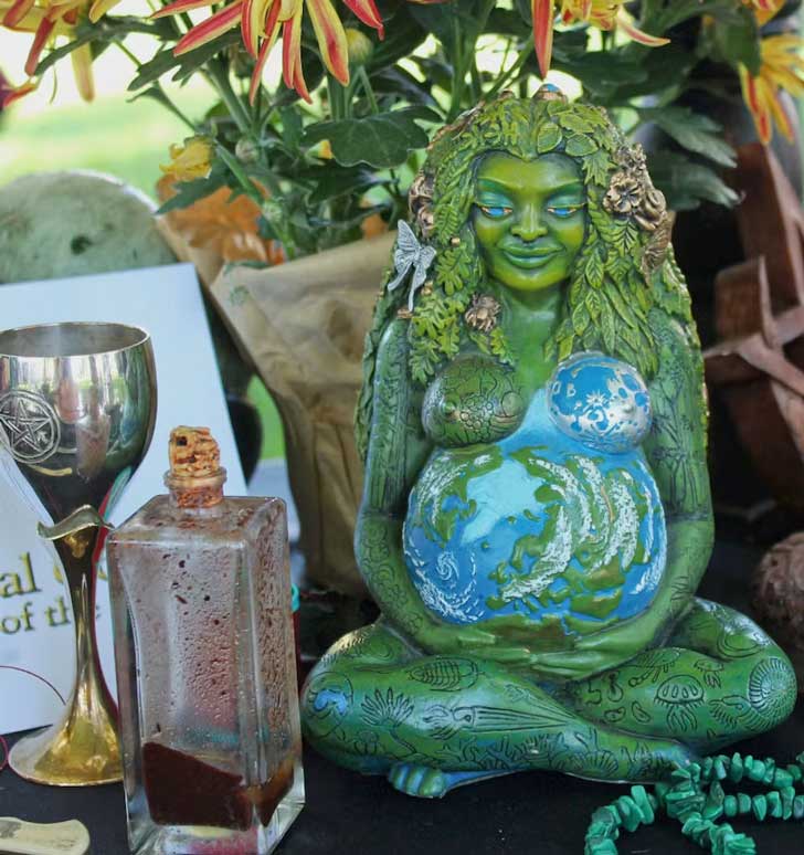 A statue of Mother Earth on an alter