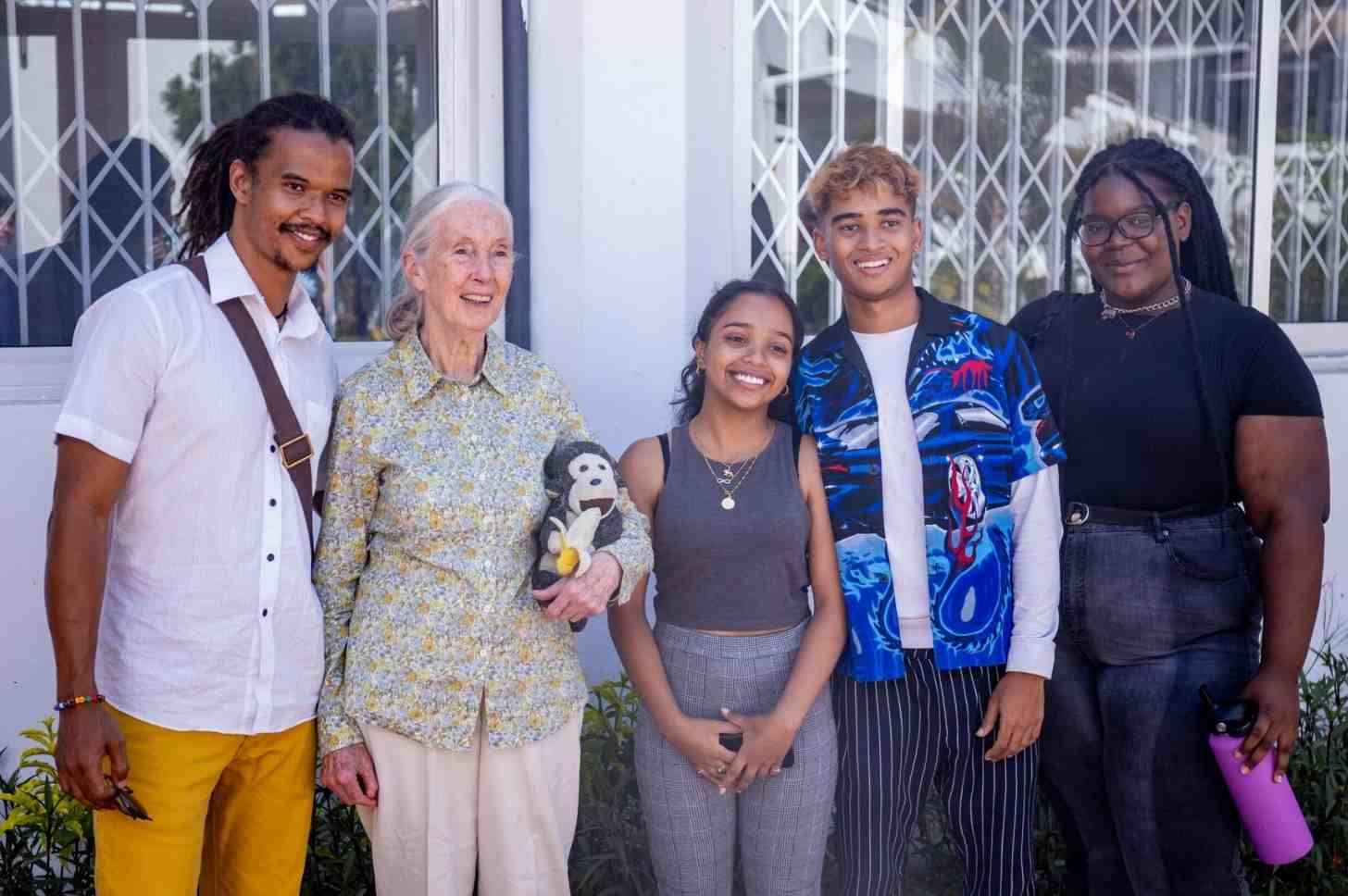 Jange Goodall (second from left) and Merlin Van Lawick (far left) at a Roots and Shoots event in Dar es Salaam. She is accompanied by her other grandchildren Angel Van Lawick and Nick Van Lawick. Image © of Jane Goodall Institute.