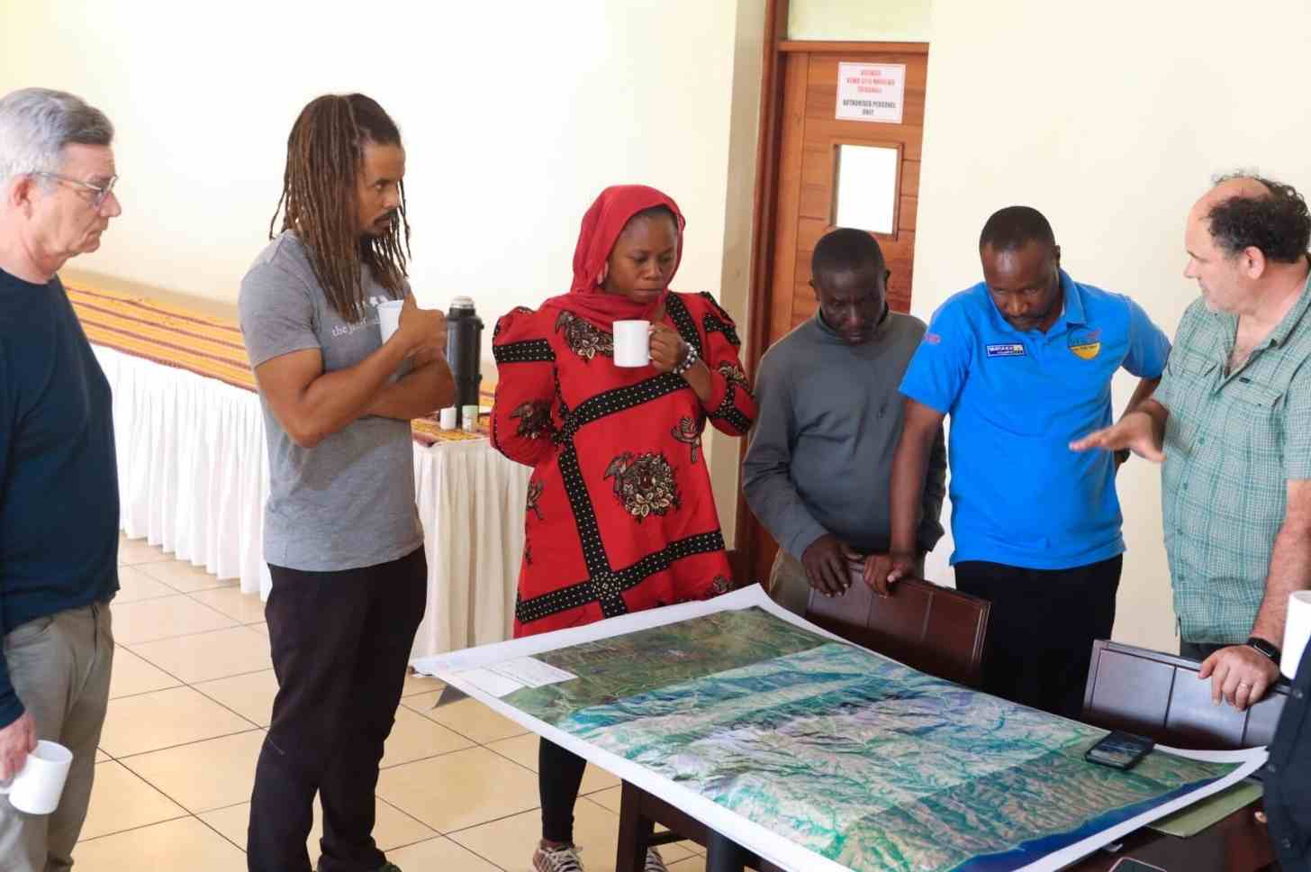 Merlin Van Lawick participating in a community mapping practice at Kagunga Village, Tanzania. Image © Jane Goodall Institute.