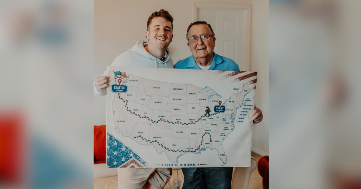 A young man, Sam Weidenhofer, and an older man, veteran Ed Bambas, smile together while holding up a map of the United States