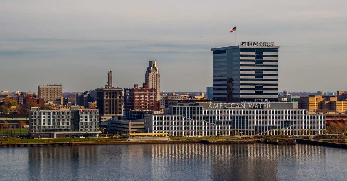 A large body of water with a cityscape of Camden, New Jersey in the background
