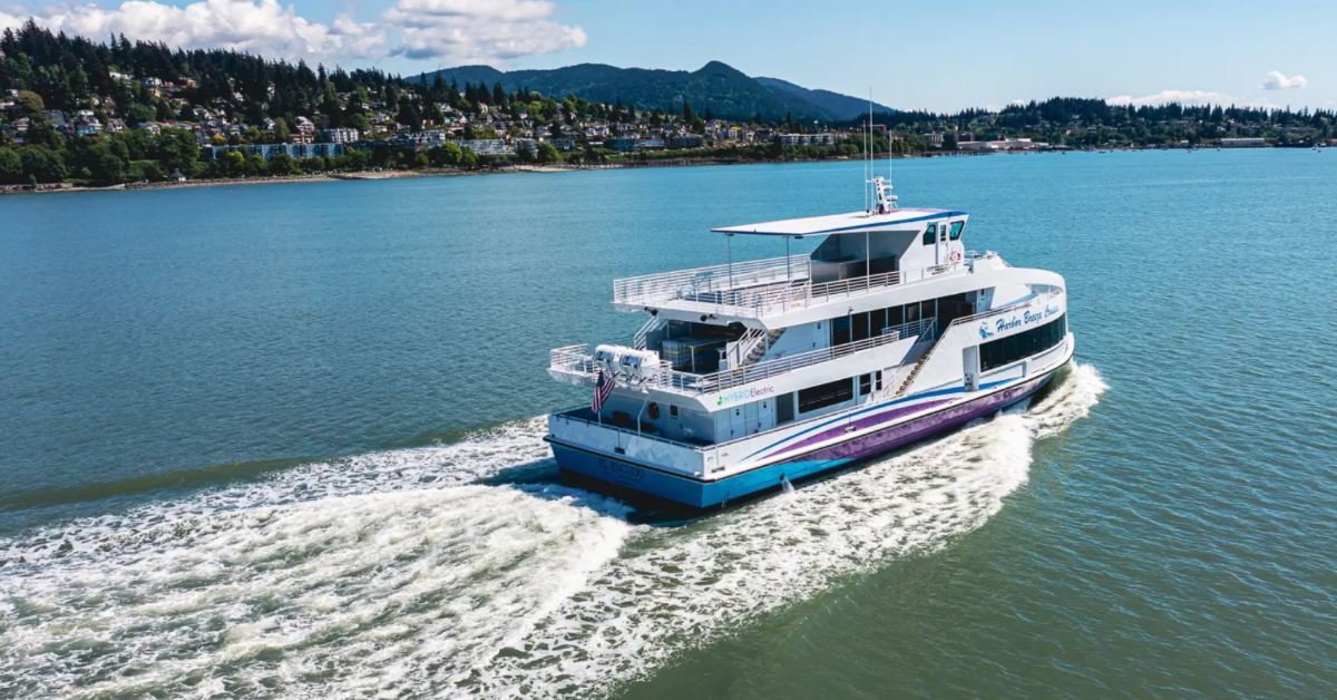 A boat photographed from a distance, on the water, called El Escudo