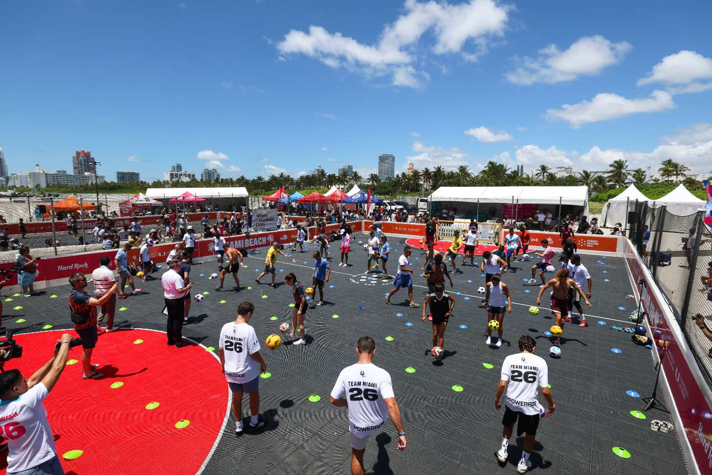 Hundreds of people gather to juggle soccer balls at a play park in Miami