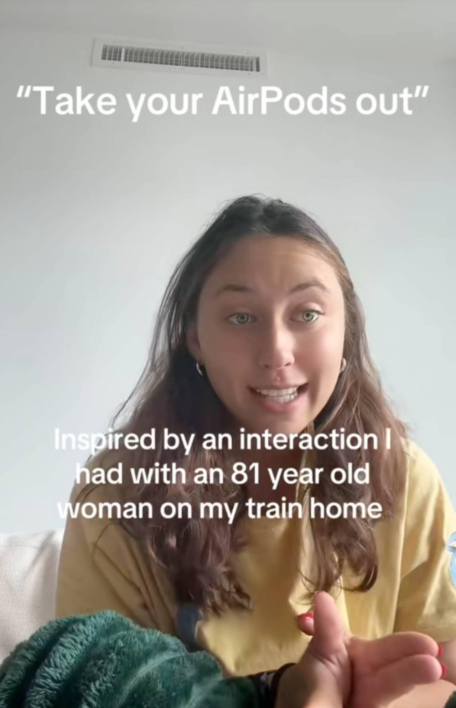 A woman smiles while talking to the camera. Her caption says: "Take your AirPods out" and "Inspired by an interaction I had with an 81 woman on my train home"