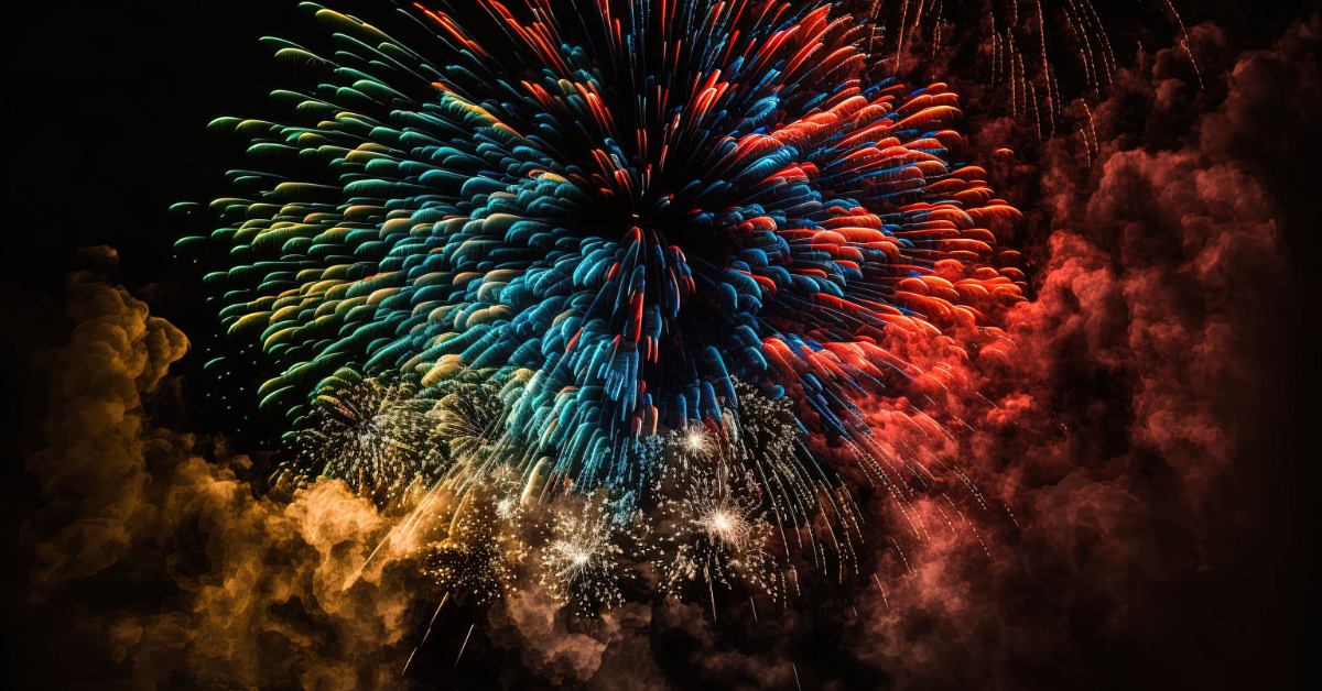 Red, blue, and yellow fireworks light up the night sky