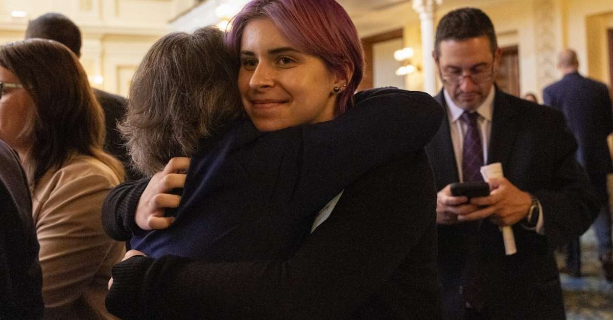 Candor Plum hugs Assemblywoman Luanne Peterpaul as Bill S2260 / A2218 passes the Aseemlby in Trenton on June 30, 2026