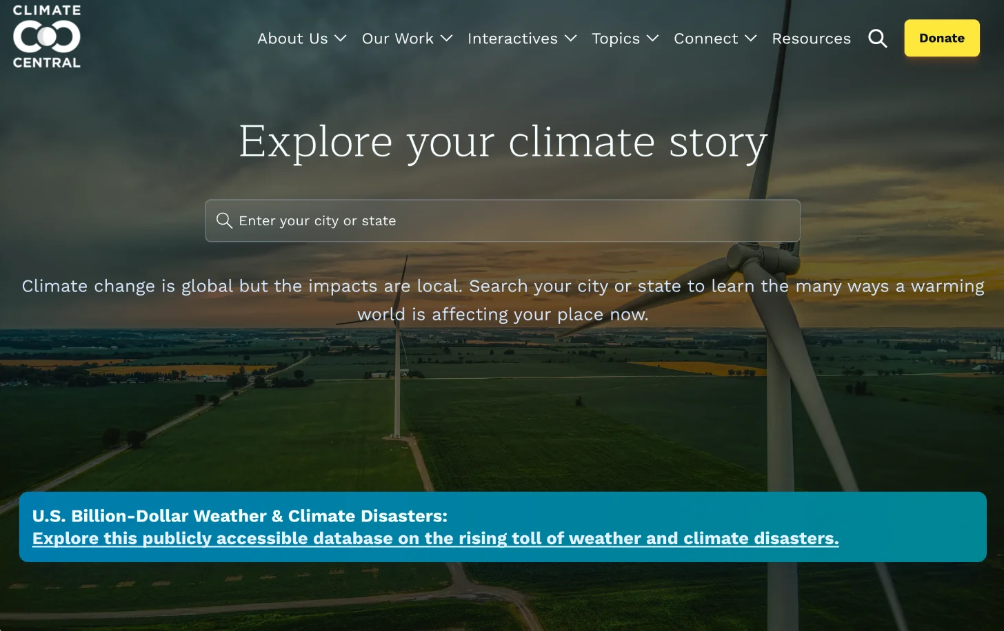 Aerial view of agricultural fields with a wind turbine in the foreground. Search bar overlaid with text "Explore your climate story" and "Enter your city or state." Below is a blue banner stating "U.S. Billion-Dollar Weather & Climate Disasters: Explore this publicly accessible database on the rising toll of weather and climate disasters."