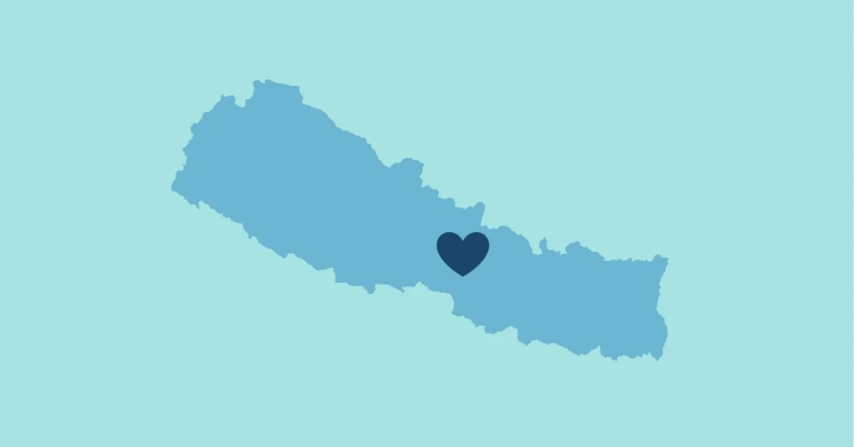 Map of Nepal in blue with a dark blue heart symbol positioned in the central region.